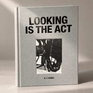 Custom cloth-bound art book with black and gold foil and recessed tipped-on cover image